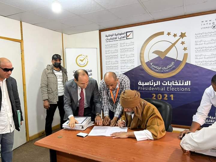 Saif Al-Islam Gaddafi singing documents at the registration center in Sebha, Libya. Photo: Twitter